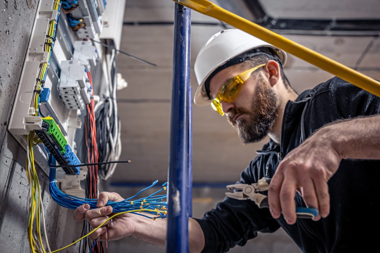Electrician working on switchboard upgrade