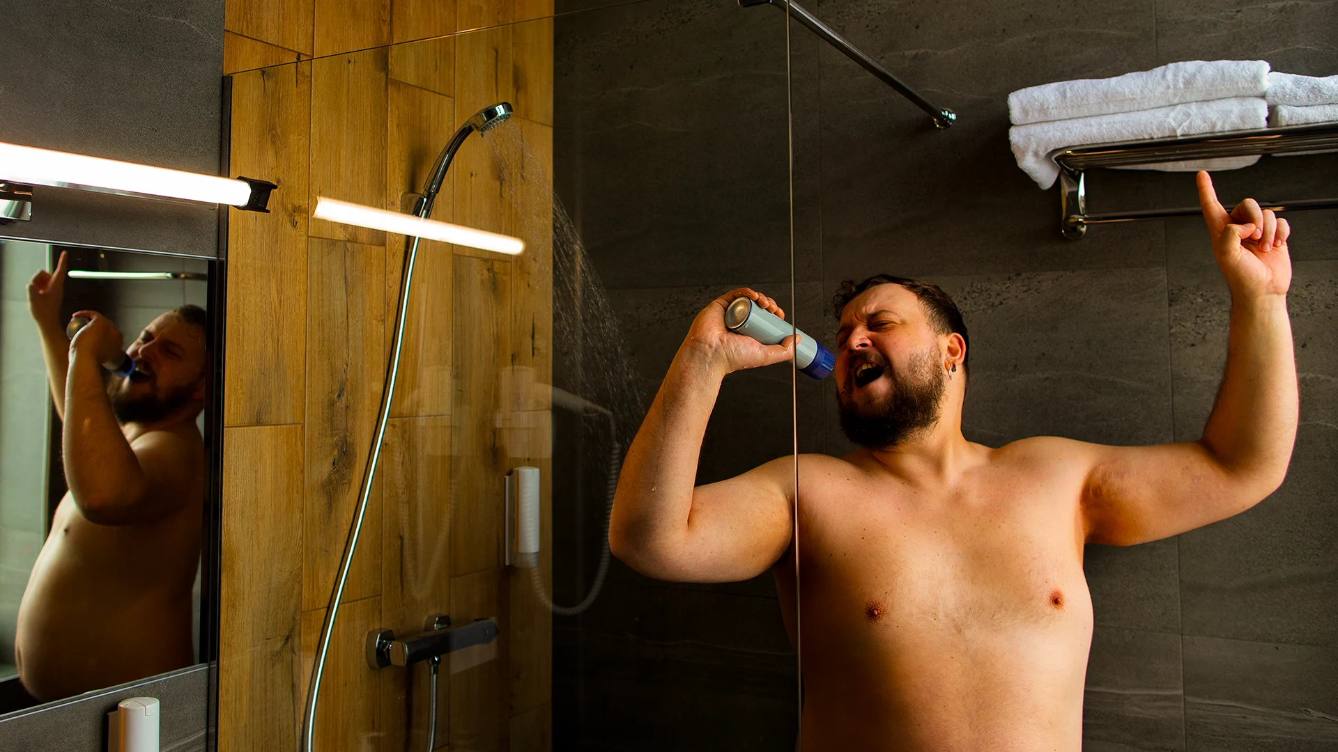 man enjoying hot water shower