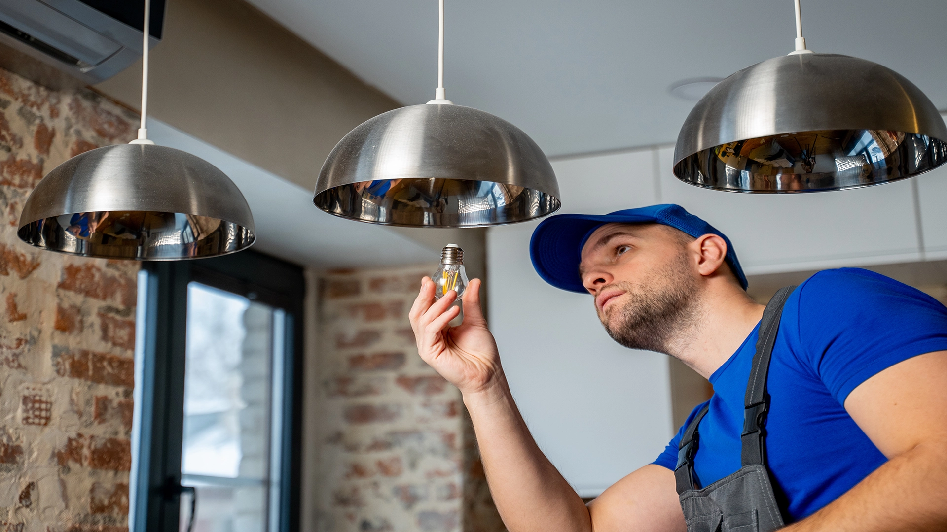 male electrician changes-LED lights